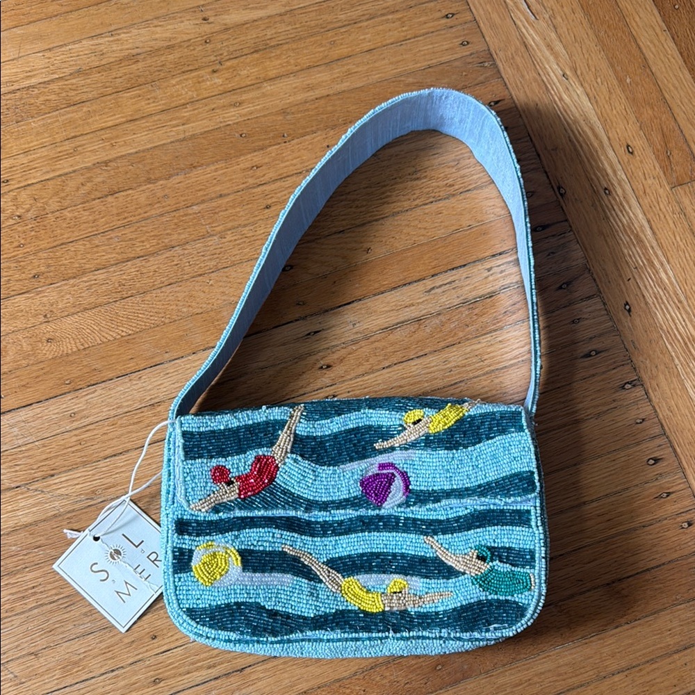 Sol and Mer swimmers beaded bag